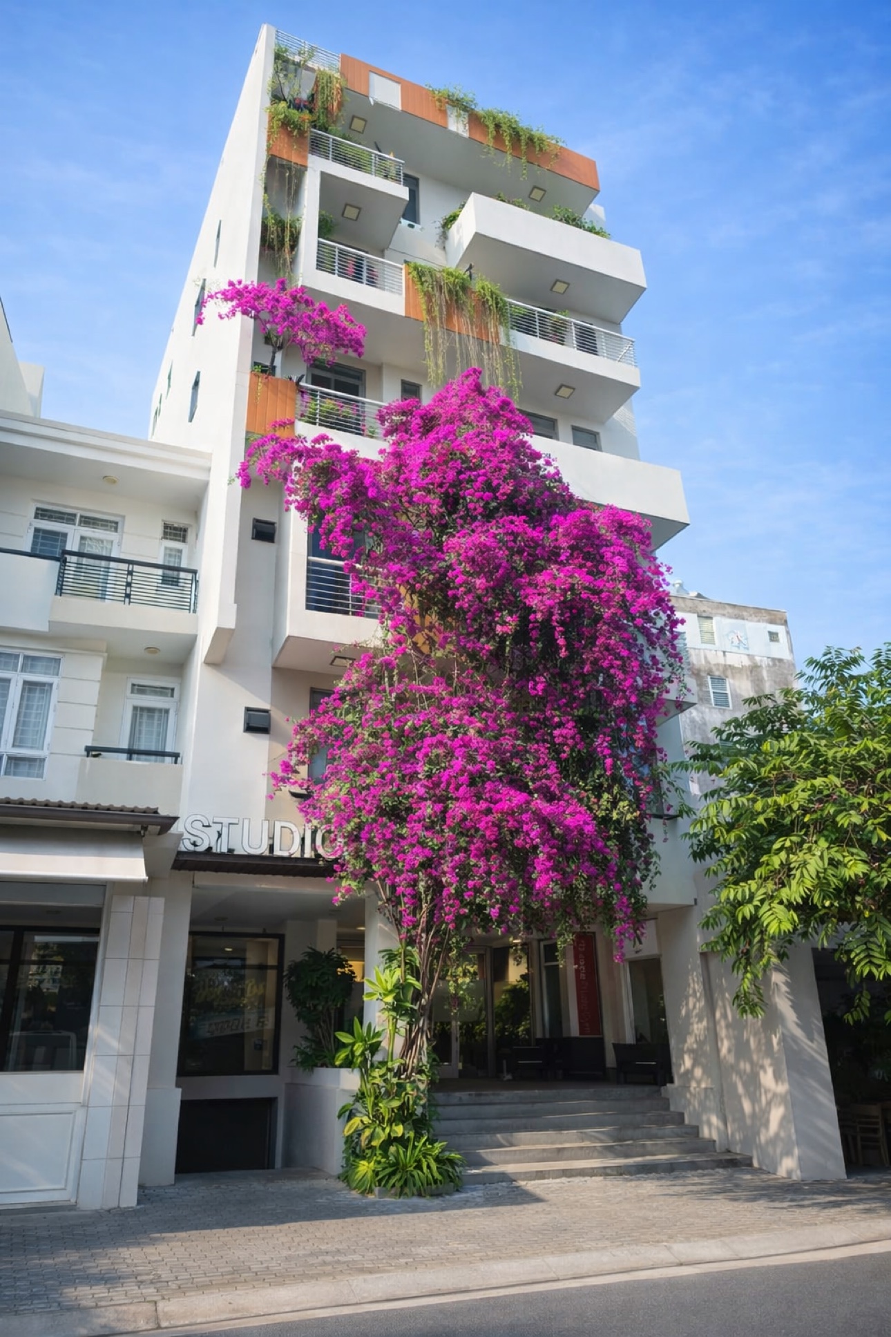 Studio79 building exterior with balconies and bougainvillea in District 7, Ho Chi Minh City